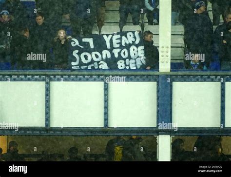 Everton fans hold up banners in protest against the clubs board after ...