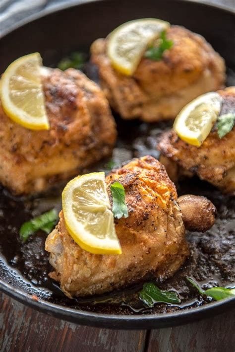 Crispy Lemon Pepper Chicken Thighs - Garnished Plate