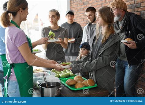 Volunteers Are Giving Food To The Homeless Poor : The Concept Of Humane ...