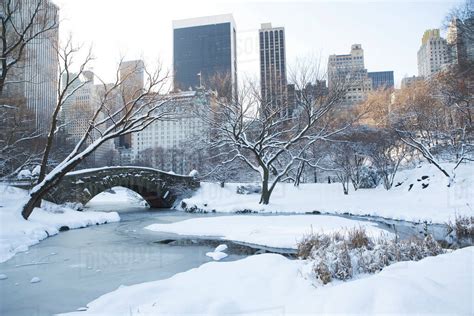 USA, New York City, View of Central Park in winter with Manhattan ...