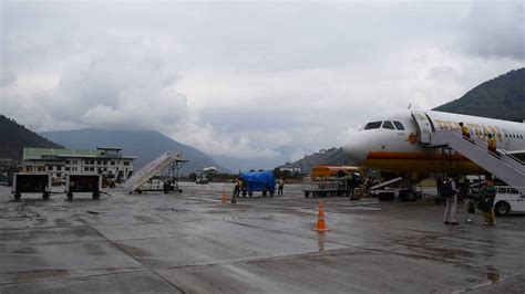 Airplane landing in Paro International Airport, Bhutan shot from tarmac - YouTube