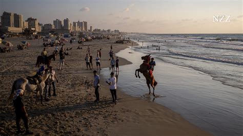 On beaches in Israel and Palestine, photos show common ground