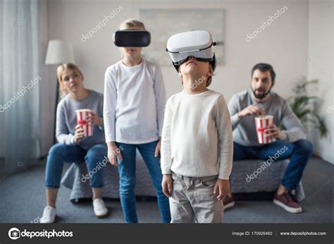 Kids in vr headsets at home — Stock Photo © IgorTishenko #170926460