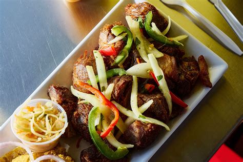 Haitian Griot and Pikliz Recipe | Wine Enthusiast