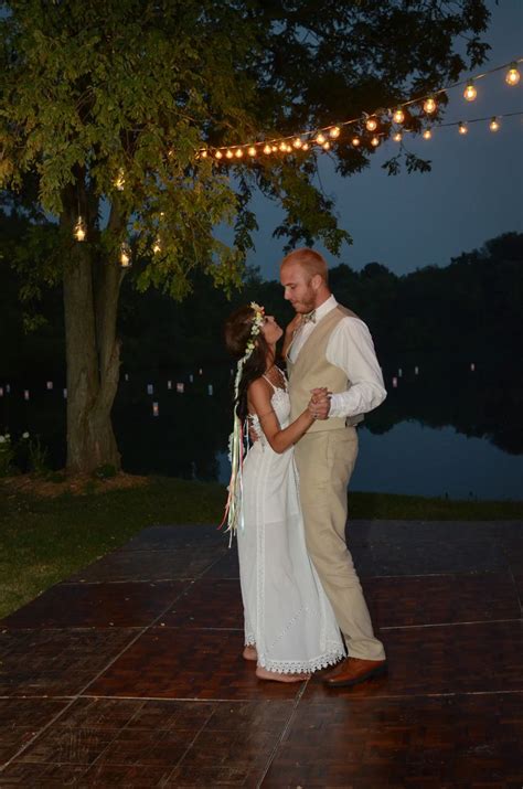 Their first dance, under the stars and lights. Floating lanterns on the lake from www ...