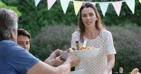 Family eating outside together in summer, Stock Video - Envato Elements