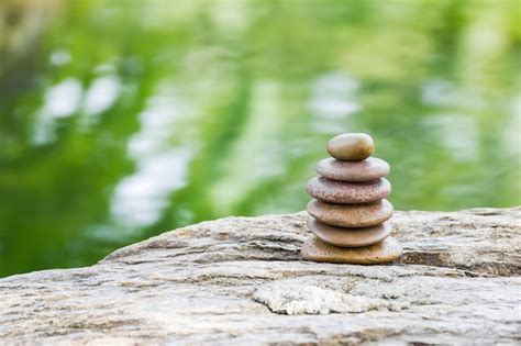 Premium Photo | Stack of zen rocks in garden