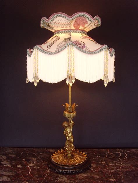 Antiques Atlas - Ormolu Cherub Table Lamp Silk Crewel Work Shade