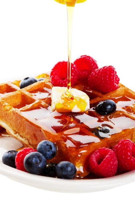 Syrup Pouring Over Waffles stock photo. Image of butter - 19281166