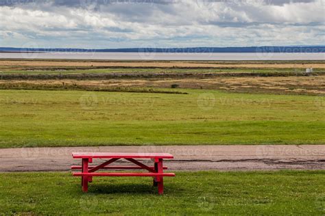 Red picnic table at a seaside park in Nova Scotia, Canada 22465617 Stock Photo at Vecteezy