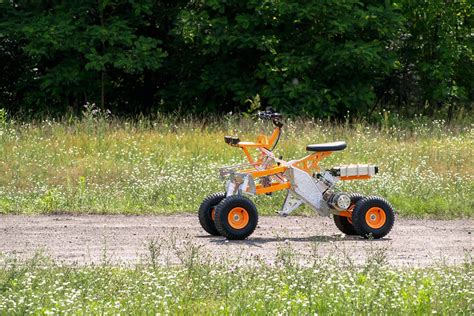 Tilting electric quad gets menacing off-road big brother