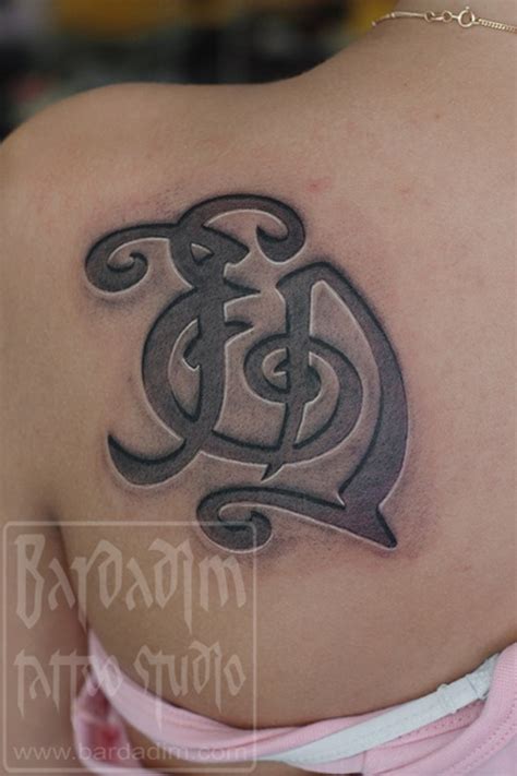 Engraved monogram tattoo by George Bardadim: TattooNOW