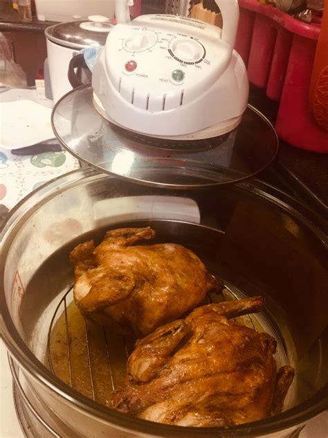 two cooked chickens in an electric pressure cooker