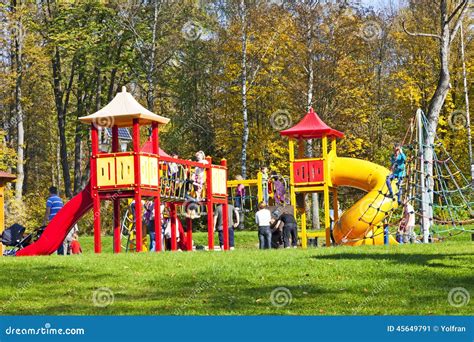 Kids Playing In A Park Playground Editorial Photo - Image of grass, zdroj: 45649791