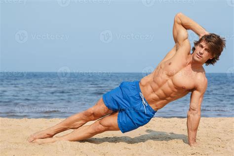 Muscular man during his workout on the beach 16114378 Stock Photo at ...