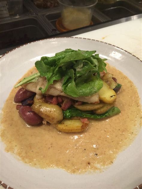 Pan seared red snapper over a bed of fingerling potatoes, pancetta and spinach and Sambuca cream ...