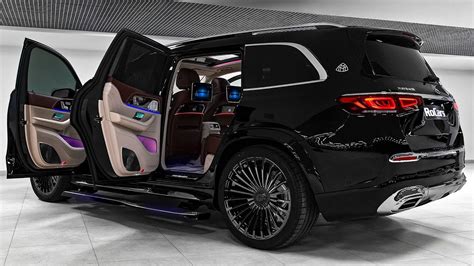 the interior of a black suv with its doors open