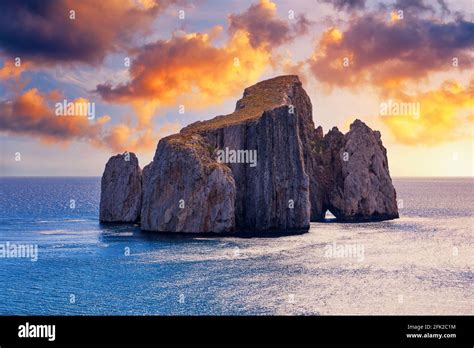 High cliffs of Mediterranean coast, "Pan di Zucchero" stack rock in ...