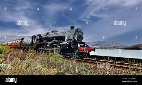 FORT WILLIAM SCOTLAND VIEW OF BEN NEVIS AND LOCH EIL THE JACOBITE STEAM TRAIN LEAVING CORPACH ...