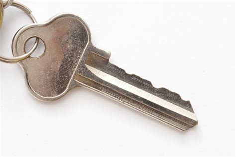 Free Image of Silver house key on white | Freebie.Photography