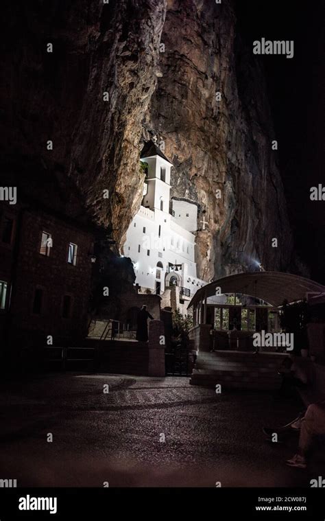 Orthodox monastery of Ostrog, Montenegro. Night photo of Ostrog monastery lightened with ...