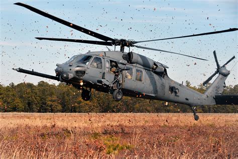 An HH-60 Pave Hawk helicopter prepares to land at the landing zone during combat search and ...