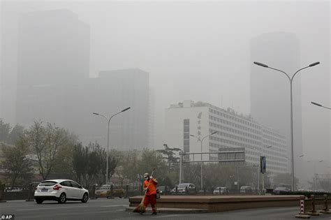 Beijing residents brave apocalyptic air pollution as city smothered by worst smog so far this ...