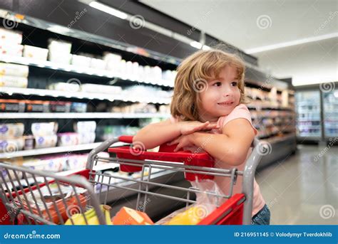 Kid with Shopping Cart Buying Food at Grocery Store or Supermarket ...