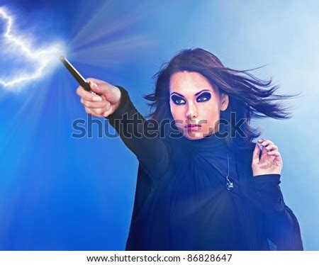 Young Woman With Magic Wand Casting Spells. Stock Photo 86828647 ...