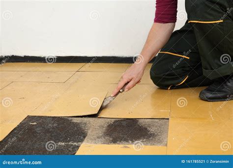 Old Vinyl Tiles Removal from Floor in a Room or Kitchen Stock Image ...