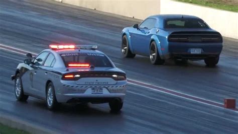 Two Dodge Challenger Hellcats Outrun Police Charger At Drag Strip