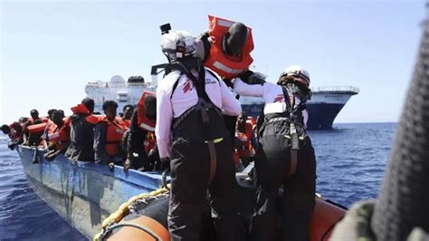 Migrant surge strains Italian resources, spurs Coast Guard rescues ...