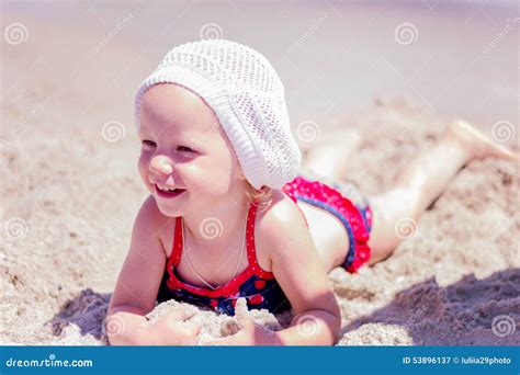 Beautiful Little Girl Lying On The Beach Royalty-Free Stock Photo | CartoonDealer.com #53896137