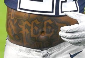 Ezekiel Elliott has a very appropriate 'feed me' stomach tattoo