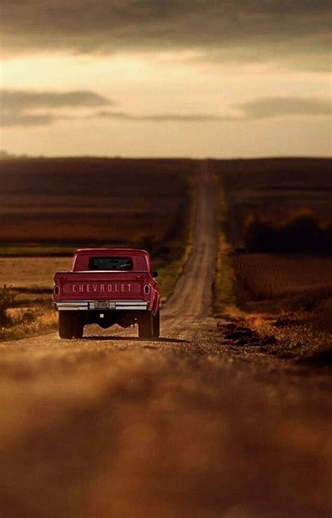 Red Pickup Truck in a Country Field