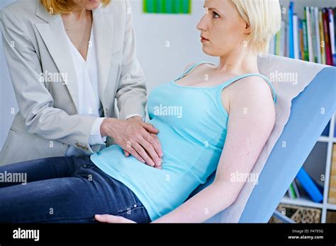 ABDOMEN PALPATION WOMAN Stock Photo - Alamy