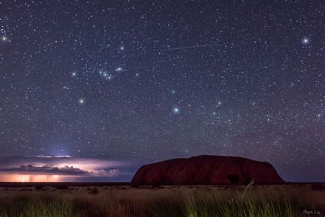 Lightning and Orion Beyond Uluru - Astronomy daily picture for May 11 ...