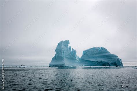 Icebergs floating in the melting sea ice in the Davis Strait. Stock ...