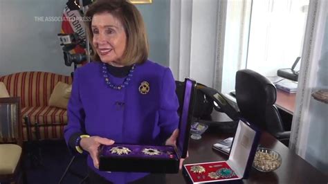 Pelosi shows off new office adorned with honors