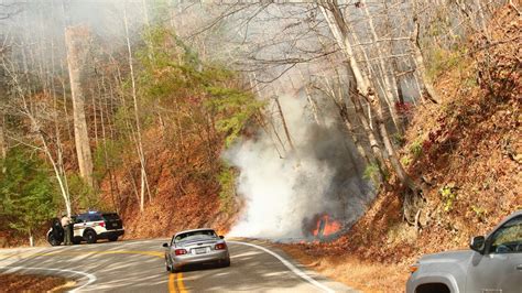 Crews contain wildfire on 'The Dragon' from motorcycle crash, lanes back open | wbir.com