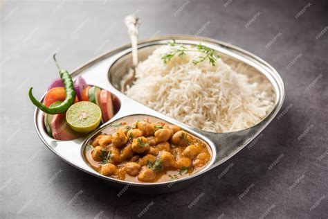 Premium Photo | Indian food chole chawal or spicy chickpea curry with ...