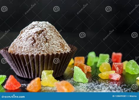 Freshly Baked Muffins with Candied Fruit on a Black Table Stock Image - Image of birthday ...