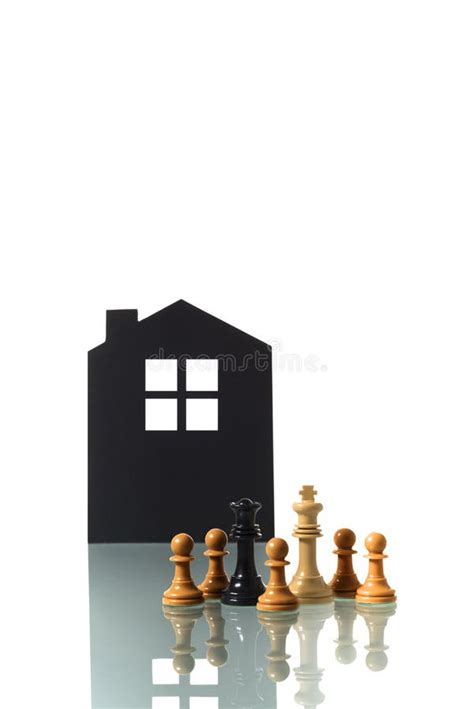 Chess Pieces with Silhouette of a House in the Background Stock Image - Image of black ...