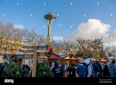 Seattle Christmas Market scene with vendors and the Space Needle at the Seattle Center in ...