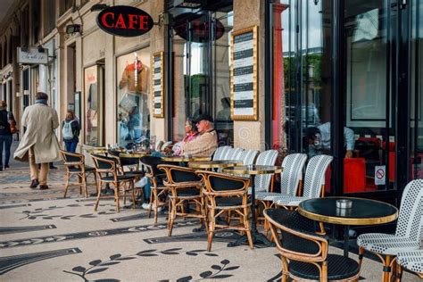 Vintage Tables in Outdoor Cafe on Narrow Street in Paris, France ...