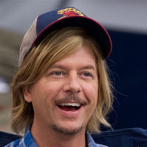 a close up of a person wearing a hat and looking at the camera with a ...