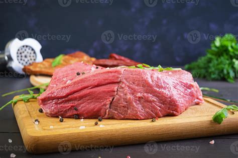 Raw meat. Fresh beef on wooden background 8170950 Stock Photo at Vecteezy