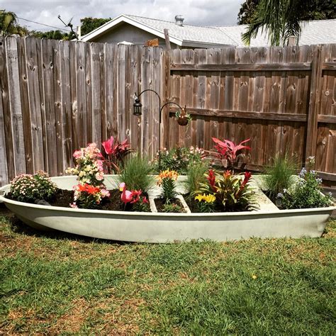 Boat Planter #diy | Rock garden design, Nautical landscaping, Lakehouse decor