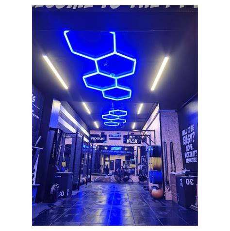 the inside of a gym with blue lighting