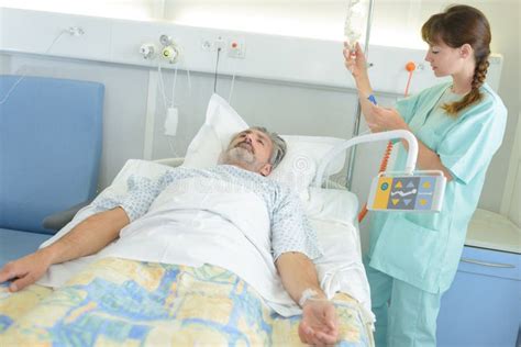 Doctor or Nurse Talking To Patient in Hospital Stock Image - Image of ...